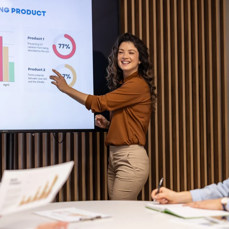 Woman delivering a data storytelling presentation to a business audience